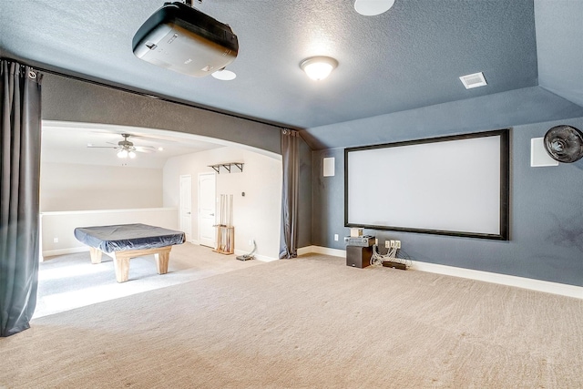 carpeted home theater room with ceiling fan, lofted ceiling, a textured ceiling, and billiards