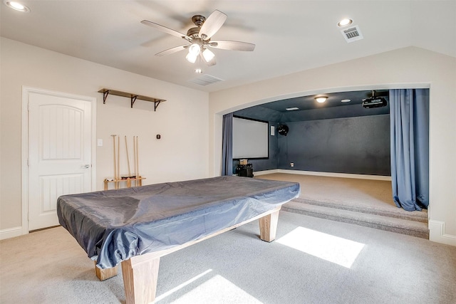 game room featuring vaulted ceiling, light carpet, ceiling fan, and billiards