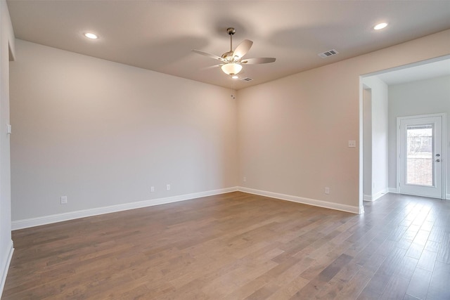 unfurnished room featuring ceiling fan and wood-type flooring