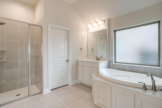 bathroom with lofted ceiling, vanity, independent shower and bath, and tile patterned floors