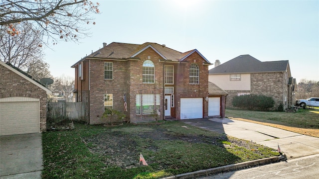 view of front property with a garage and a front yard