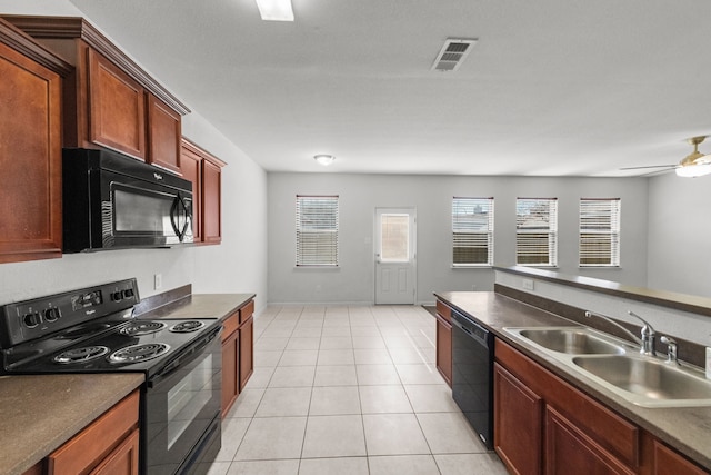 kitchen featuring ceiling fan, sink, light tile patterned floors, and black appliances