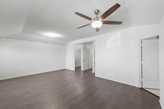 empty room featuring ceiling fan, dark wood-type flooring, and lofted ceiling