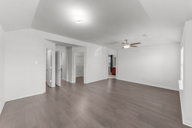 unfurnished room featuring lofted ceiling, ceiling fan, and dark wood-type flooring