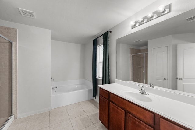 bathroom featuring tile patterned flooring, vanity, and plus walk in shower