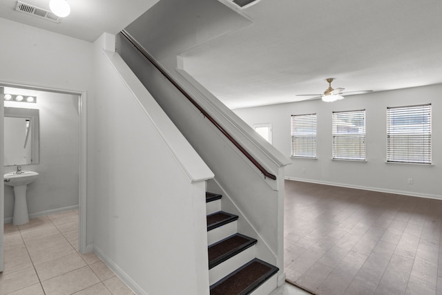 stairway with ceiling fan