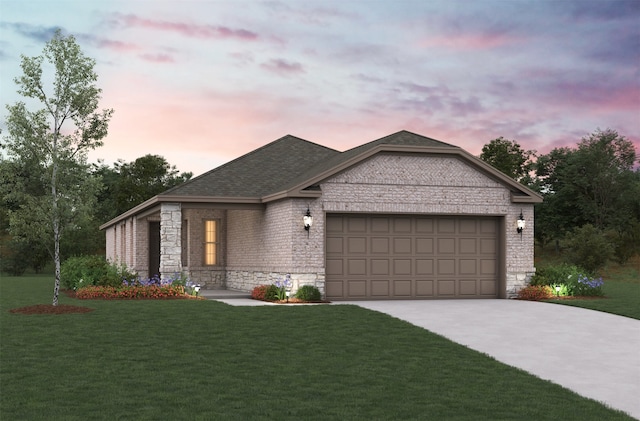 view of front of house featuring a garage and a yard