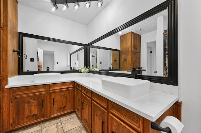 bathroom featuring vanity and a textured ceiling