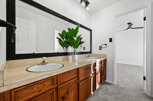 bathroom with vanity and a textured ceiling