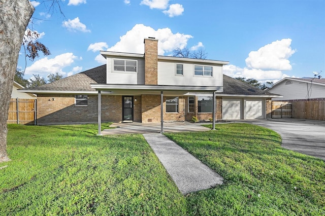 exterior space with a garage and a lawn