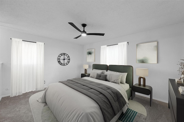 carpeted bedroom with ceiling fan and a textured ceiling