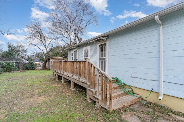 wooden deck with a lawn