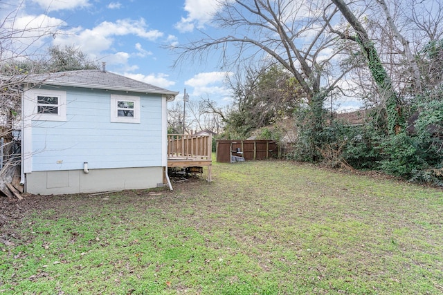 view of yard featuring a wooden deck