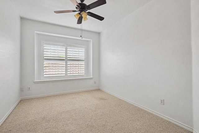 spare room with carpet and ceiling fan