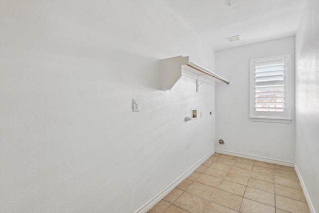 laundry room with electric dryer hookup, hookup for a gas dryer, hookup for a washing machine, and light tile patterned floors