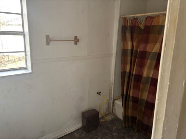 bathroom featuring shower / bath combination with curtain