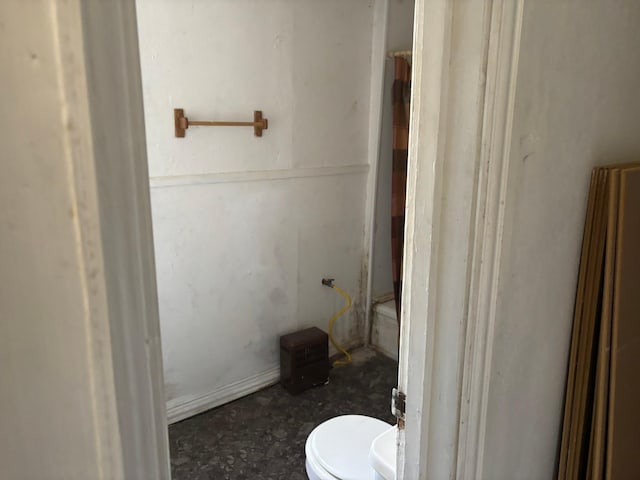 bathroom featuring toilet