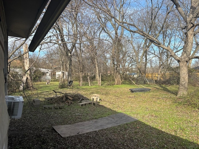 view of yard with central AC unit