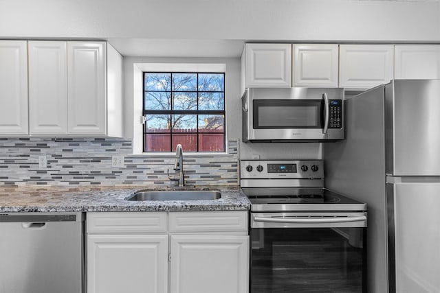 kitchen with white cabinets, sink, and stainless steel appliances