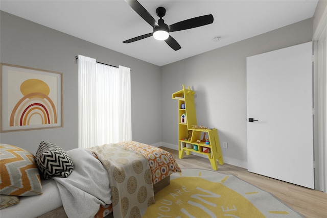 bedroom featuring ceiling fan and light wood-type flooring