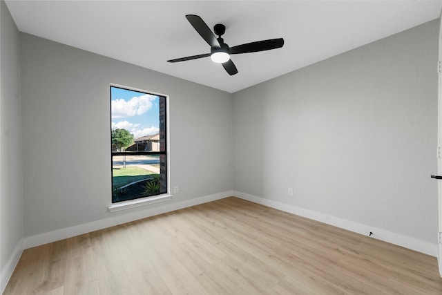 unfurnished room with ceiling fan and light wood-type flooring