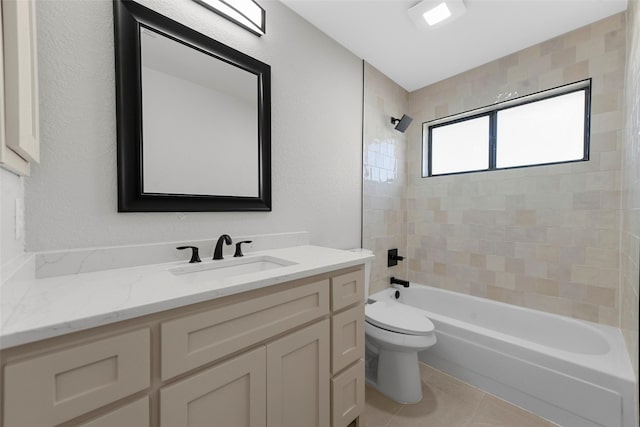 full bathroom with tile patterned flooring, vanity, toilet, and tiled shower / bath