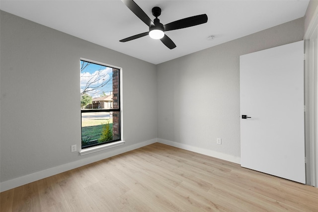 unfurnished room featuring ceiling fan and light wood-type flooring