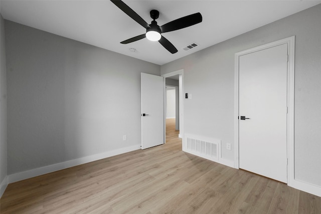 unfurnished bedroom with ceiling fan and light hardwood / wood-style flooring