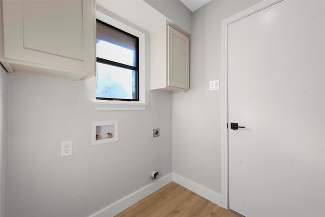 washroom featuring cabinets, washer hookup, light hardwood / wood-style floors, and electric dryer hookup