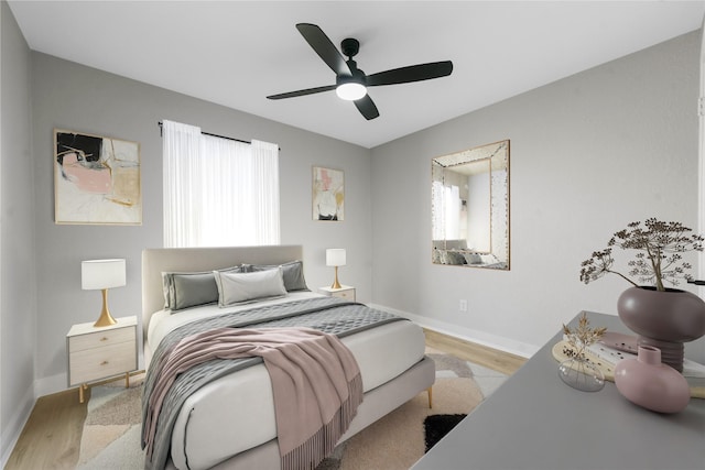 bedroom featuring ceiling fan and light wood-type flooring