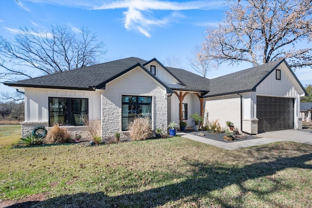 view of front of home with a garage and a front yard