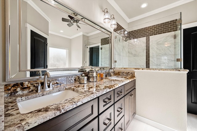 full bathroom featuring ornamental molding, a sink, and a tile shower