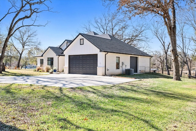 view of front of house featuring a garage and a front yard