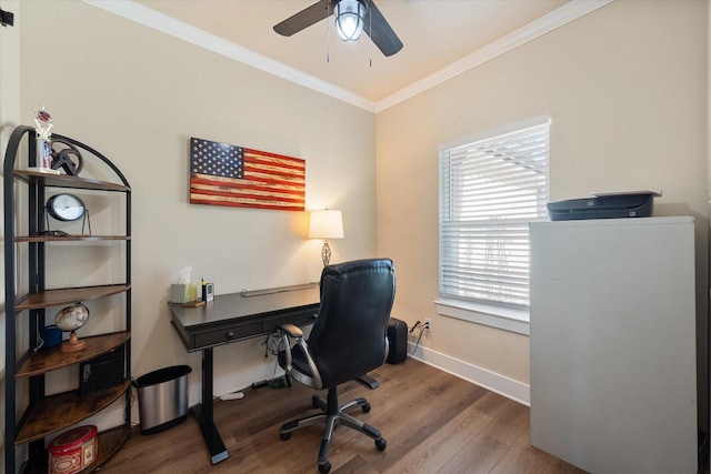 office area featuring ornamental molding, a ceiling fan, baseboards, and wood finished floors