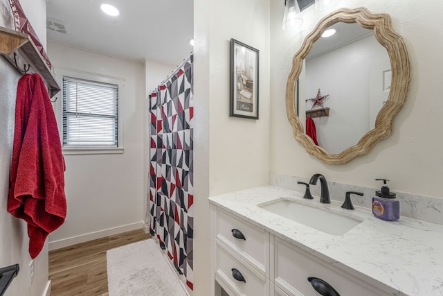 bathroom with vanity, hardwood / wood-style floors, and a shower with curtain