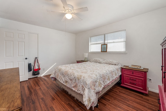 bedroom with dark wood-type flooring and ceiling fan