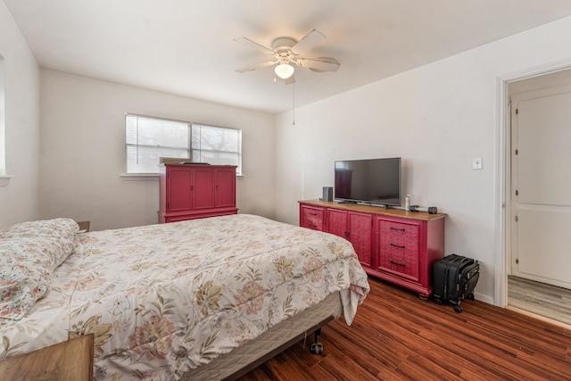 bedroom with dark wood-type flooring and ceiling fan