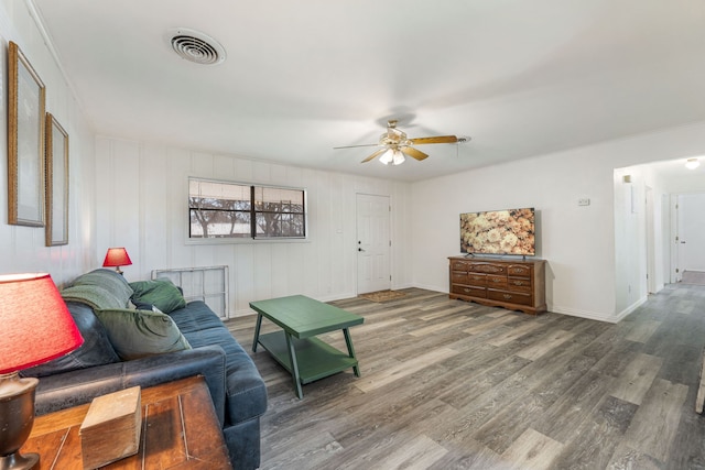 living room with hardwood / wood-style flooring and ceiling fan