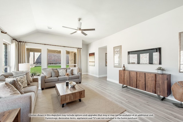 living room with ceiling fan, light hardwood / wood-style floors, and vaulted ceiling