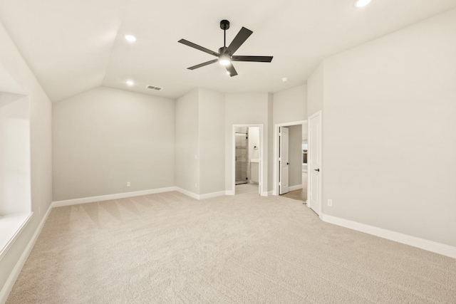 unfurnished bedroom featuring light carpet, baseboards, vaulted ceiling, and recessed lighting