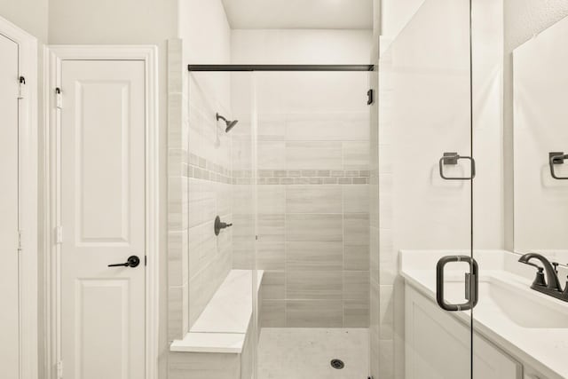 full bath featuring a stall shower and vanity