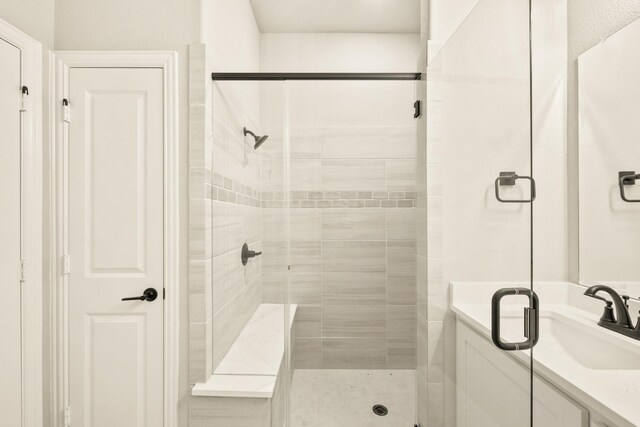 carpeted bedroom featuring ensuite bath, ceiling fan, and vaulted ceiling