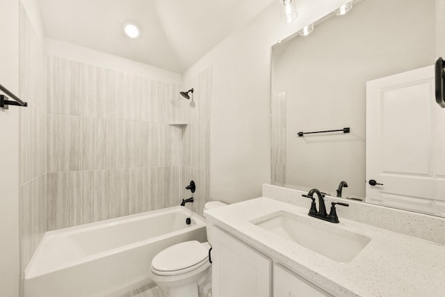 bathroom featuring toilet, vanity, and bathing tub / shower combination