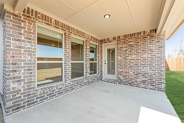 view of patio / terrace featuring fence