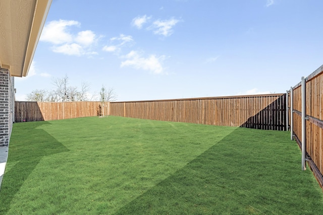 view of yard with a fenced backyard