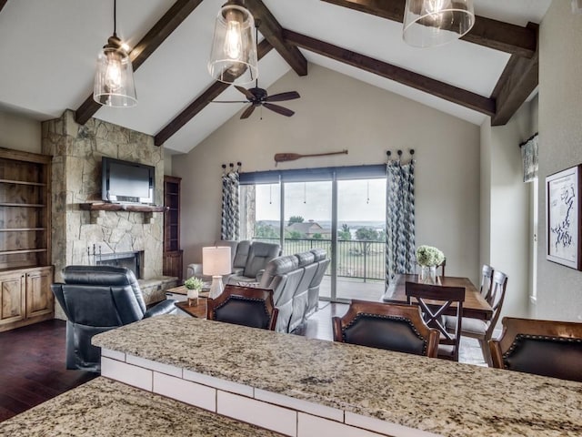 living room with high vaulted ceiling, dark hardwood / wood-style floors, beamed ceiling, ceiling fan, and a fireplace