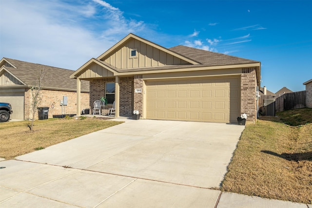 view of front of home with a garage and a front lawn