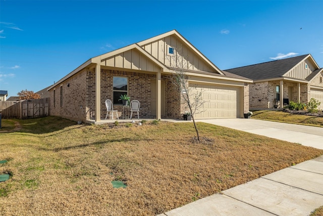 view of front facade with a garage and a front yard