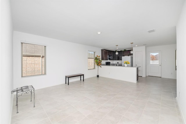 living room with sink and light tile patterned floors