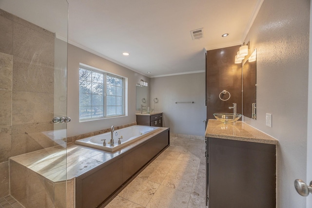 bathroom featuring vanity, a tub, and crown molding